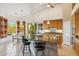 Spacious kitchen island featuring barstool seating and an adjacent dining area at 4448 E Sleepy Ranch Rd, Cave Creek, AZ 85331