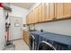 Laundry room featuring side by side washer and dryer units and storage at 4448 E Sleepy Ranch Rd, Cave Creek, AZ 85331