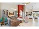 Spacious living room featuring tile floors, comfortable seating, and a red accent wall at 4448 E Sleepy Ranch Rd, Cave Creek, AZ 85331