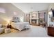 Serene main bedroom featuring a fireplace, sitting area, and picturesque sunset views at 4448 E Sleepy Ranch Rd, Cave Creek, AZ 85331