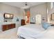 Spacious main bedroom with neutral colors, TV, and ensuite bath access at 4448 E Sleepy Ranch Rd, Cave Creek, AZ 85331
