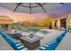 Desert backyard oasis with a pool, fireplace, lounge seating, and outdoor kitchen at 4448 E Sleepy Ranch Rd, Cave Creek, AZ 85331