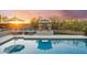 Backyard pool with outdoor seating area and fireplace perfect for entertaining at 4448 E Sleepy Ranch Rd, Cave Creek, AZ 85331