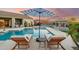 Relaxing backyard oasis with a pool, sun loungers, and outdoor seating at 4448 E Sleepy Ranch Rd, Cave Creek, AZ 85331