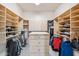 Walk-in closet featuring custom built-in shelves and cabinets at 4448 E Sleepy Ranch Rd, Cave Creek, AZ 85331