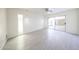 Bright bedroom with modern tile flooring and sliding doors to outdoor patio at 4528 W Butler Dr, Glendale, AZ 85302