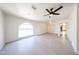 Spacious bedroom has tiled floors, large arch window, and ample room at 4528 W Butler Dr, Glendale, AZ 85302