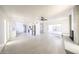 Spacious living room with a ceiling fan, fireplace and modern tile flooring at 4528 W Butler Dr, Glendale, AZ 85302