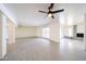 Bright, expansive living room with tile flooring and fireplace at 4528 W Butler Dr, Glendale, AZ 85302