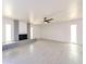 Open-concept living room features tiled floors, a fireplace and bright windows at 4528 W Butler Dr, Glendale, AZ 85302