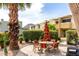 Outdoor courtyard with patio dining set, landscaping, and mountain view in the distance at 4630 N 68Th St # 221, Scottsdale, AZ 85251