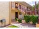 Charming exterior view of the building with desert landscaping and a stairway at 4630 N 68Th St # 221, Scottsdale, AZ 85251