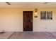 Image of the secured front door with view of the window and a security door at 4630 N 68Th St # 221, Scottsdale, AZ 85251