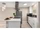 Bright kitchen with stainless steel appliances, white cabinets, tile backsplash, and modern fixtures at 4630 N 68Th St # 221, Scottsdale, AZ 85251