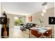 Open-concept living and dining area with wood floors, neutral tones, and access to the outside patio at 4630 N 68Th St # 221, Scottsdale, AZ 85251