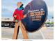 Historic Old Town Scottsdale sign with cowboy statue, rope and retail stores at 4630 N 68Th St # 221, Scottsdale, AZ 85251