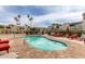 Community pool with lounge chairs, surrounded by lush landscaping, near residential buildings at 4630 N 68Th St # 221, Scottsdale, AZ 85251