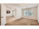 Comfortable bedroom with plush carpeting, natural light and access to the living room at 5502 N Ormondo Way, Litchfield Park, AZ 85340