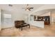 Cozy living room with plush carpet and an open layout leading into the kitchen at 5502 N Ormondo Way, Litchfield Park, AZ 85340