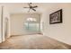 Expansive main bedroom featuring neutral carpet and a large window with natural light at 5502 N Ormondo Way, Litchfield Park, AZ 85340