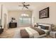 Spacious main bedroom with neutral walls, ample natural light, and comfortable furnishings at 5502 N Ormondo Way, Litchfield Park, AZ 85340