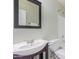 Well-maintained bathroom with a classic vanity, mirror, and fixtures, offering comfort and functionality at 5757 S 21St Ter, Phoenix, AZ 85040