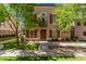 Charming two-story home with a well-manicured lawn, inviting entrance, and mature shade trees at 5757 S 21St Ter, Phoenix, AZ 85040