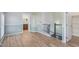 Hallway with a staircase, stylish flooring, and access to other rooms, creating an open flow at 5757 S 21St Ter, Phoenix, AZ 85040