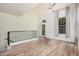 Bright loft space with wood flooring, high ceilings, and a large window with natural light at 5757 S 21St Ter, Phoenix, AZ 85040