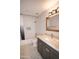 Clean bathroom with granite sink top, patterned tile floors, and a shower-tub combo at 5941 W Venus Way, Chandler, AZ 85226