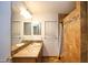 Bathroom featuring a double vanity and a tiled shower at 5941 W Venus Way, Chandler, AZ 85226