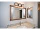 Bathroom featuring a granite countertop and stylish lighting fixture at 5941 W Venus Way, Chandler, AZ 85226