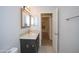 Bright bathroom with granite sink top, patterned tile floors, and a view into the hallway at 5941 W Venus Way, Chandler, AZ 85226
