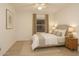 Bedroom with wood-look floors, neutral paint, and a window with blinds at 5941 W Venus Way, Chandler, AZ 85226