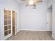 Bedroom featuring light walls, light woodgrain flooring and closet at 5941 W Venus Way, Chandler, AZ 85226