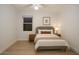 Bedroom featuring wood-look floors, neutral paint, and a window with blinds at 5941 W Venus Way, Chandler, AZ 85226