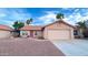 Charming single-story home with a tile roof, desert landscaping, and a two-car garage at 5941 W Venus Way, Chandler, AZ 85226