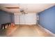 Spacious two-car garage with ample storage, a workbench area, and well-lit interiors at 5941 W Venus Way, Chandler, AZ 85226