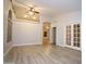 Bright living room featuring high ceilings, archway detail, closet and light woodgrain flooring at 5941 W Venus Way, Chandler, AZ 85226