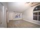 Bright living room featuring high ceilings, a large window, closet and light woodgrain flooring at 5941 W Venus Way, Chandler, AZ 85226