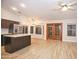 Open concept living room and kitchen area with light woodgrain floors and stainless steel appliances at 5941 W Venus Way, Chandler, AZ 85226