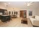 Open-concept living and dining area with hardwood floors, natural light, and a cozy seating area at 5941 W Venus Way, Chandler, AZ 85226