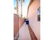 A clean and well-maintained side yard with block wall, a privacy gate, and desert landscaping at 5941 W Venus Way, Chandler, AZ 85226