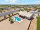 Private pool and spacious backyard offering a perfect desert retreat with a covered patio at 616 E Lavitt Ln, Phoenix, AZ 85086