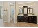 En suite bathroom featuring dual sink vanity and access to the separate shower and toilet room at 616 E Lavitt Ln, Phoenix, AZ 85086