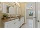 Bathroom features double sinks and granite countertops at 616 E Lavitt Ln, Phoenix, AZ 85086