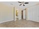 Bright bedroom boasts tile flooring and neutral walls at 616 E Lavitt Ln, Phoenix, AZ 85086