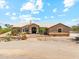Beautiful single-story home with stone accents, desert landscaping, and a tile roof at 616 E Lavitt Ln, Phoenix, AZ 85086