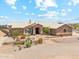 Charming single-story home with stone accents, desert landscaping, and a tile roof at 616 E Lavitt Ln, Phoenix, AZ 85086