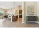 Open floor plan featuring kitchen island, dining area with chandelier, and modern decor throughout at 616 E Lavitt Ln, Phoenix, AZ 85086